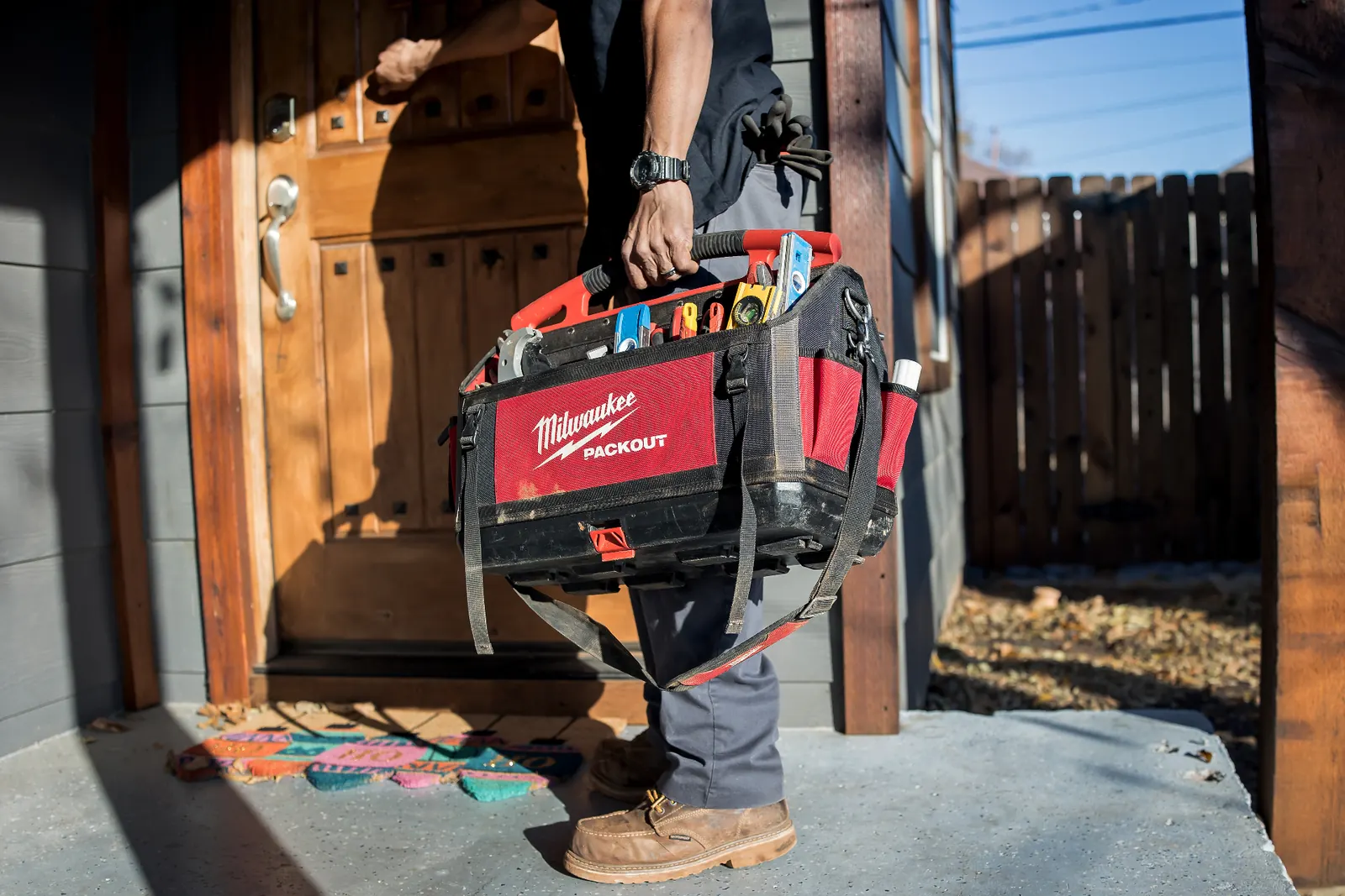 Stanley Plumbing Services technician arriving at an Oklahoma City home with a service truck parked in the driveway