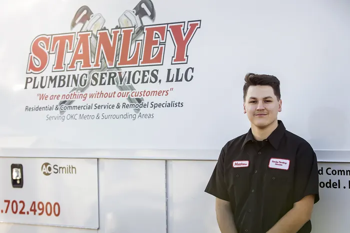 Portrait of a Stanley Plumbing Services team member (5 of 18) in uniform