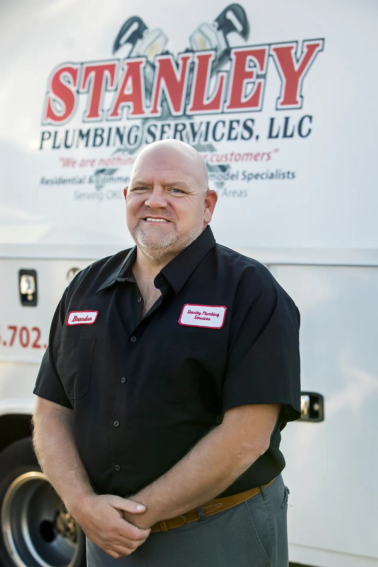 Stanley Plumbing Services technician completing a residential plumbing repair