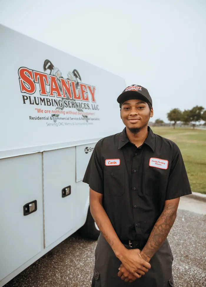 Portrait of a Stanley Plumbing Services team member (7 of 18) in uniform