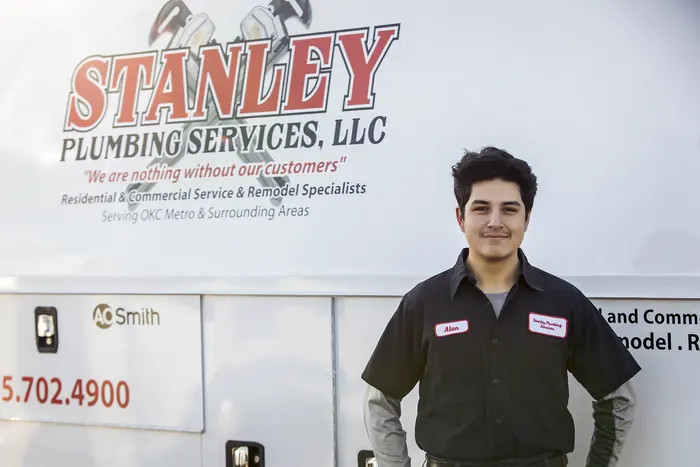 Portrait of a Stanley Plumbing Services team member (4 of 18) in uniform