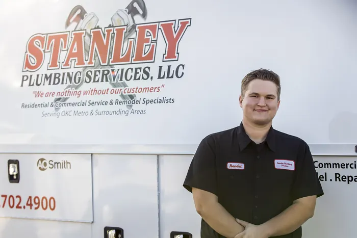 Portrait of a Stanley Plumbing Services team member (3 of 18) in uniform