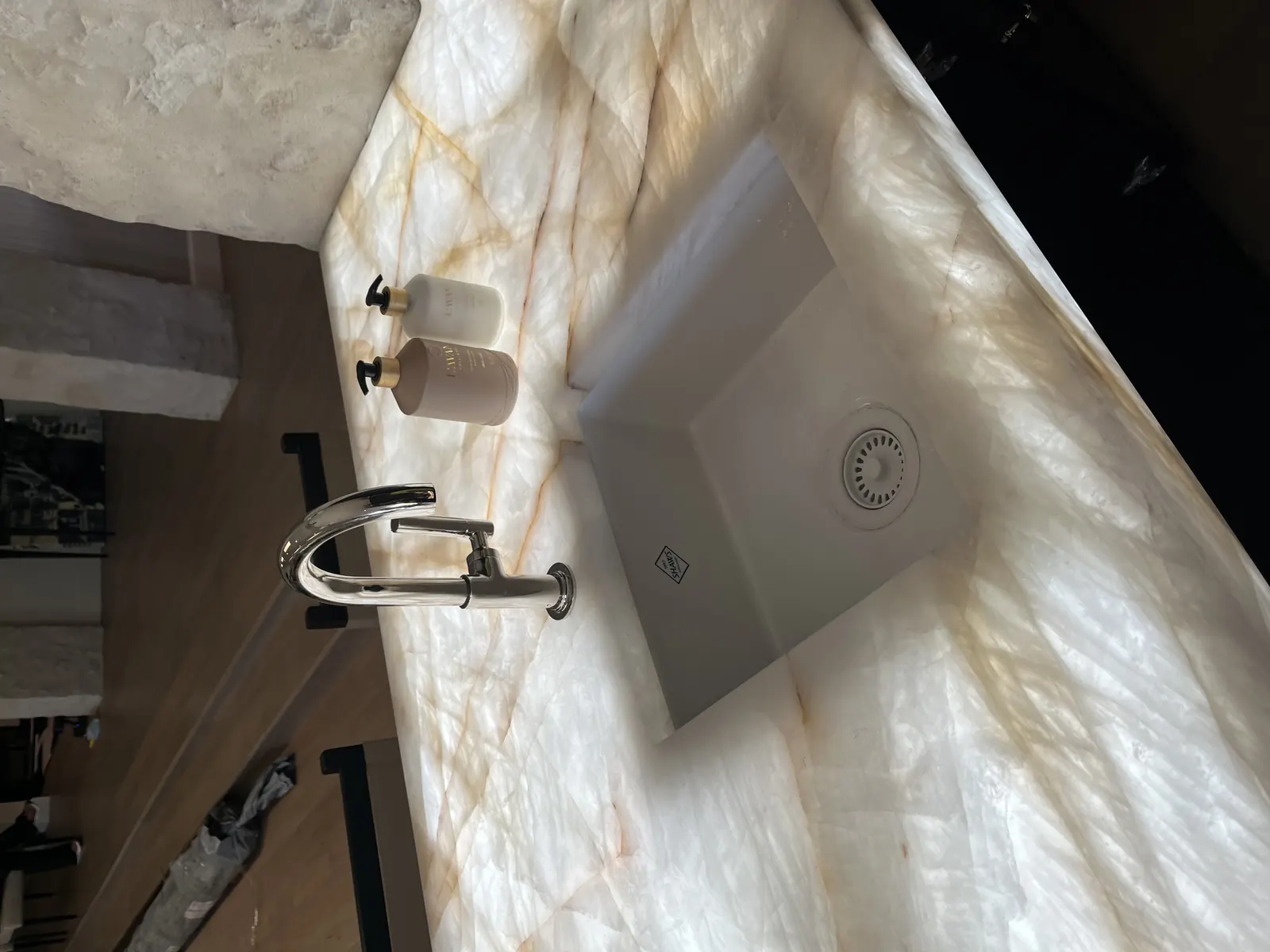 Statement stone sink detail installed during a high-end remodel