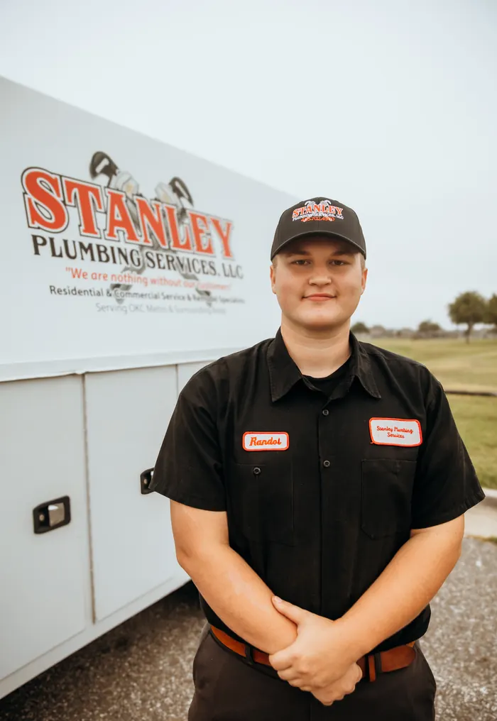 Portrait of a Stanley Plumbing Services team member (14 of 18) in uniform
