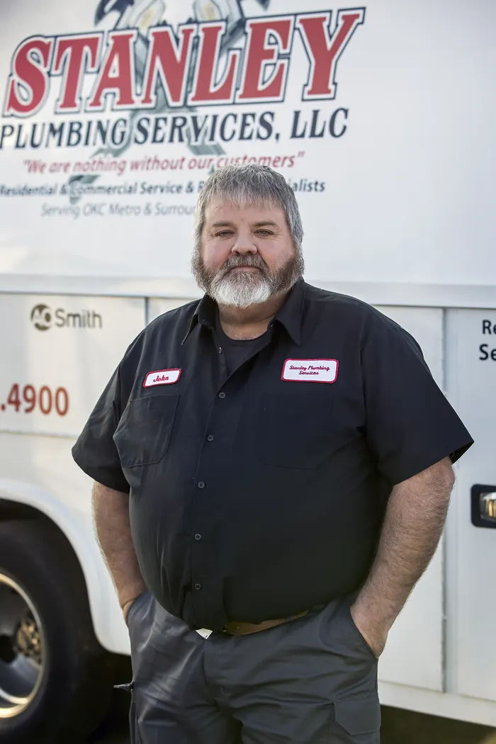 Portrait of a Stanley Plumbing Services team member (1 of 18) in uniform