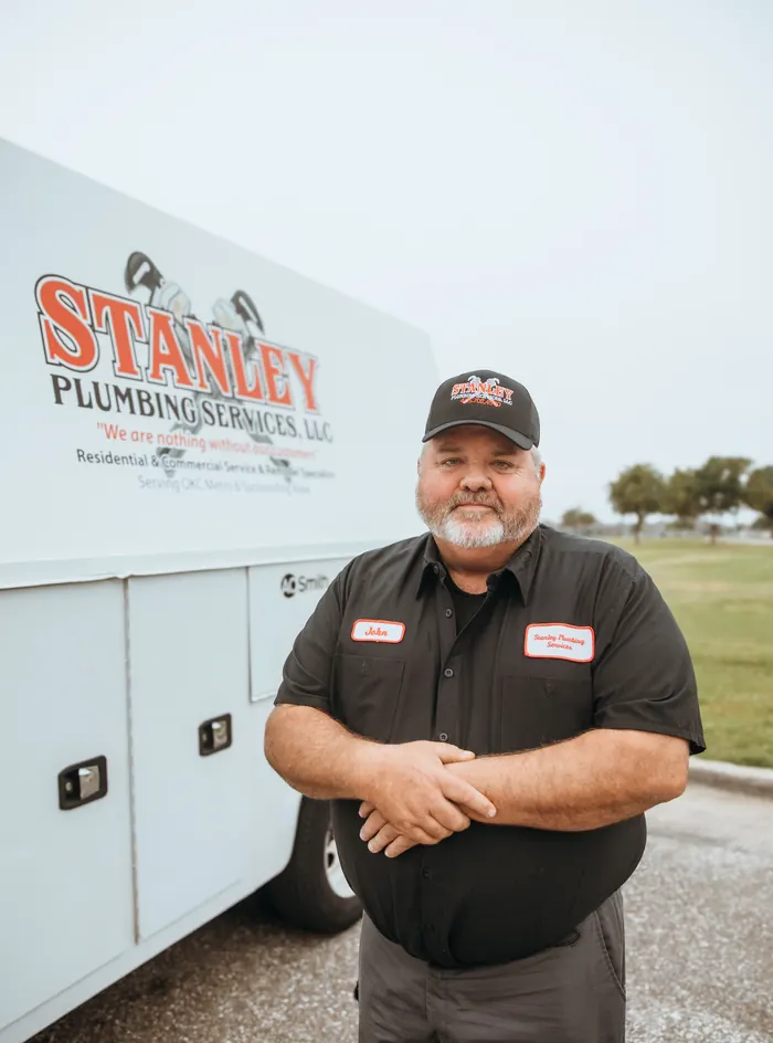 Portrait of a Stanley Plumbing Services team member (11 of 18) in uniform
