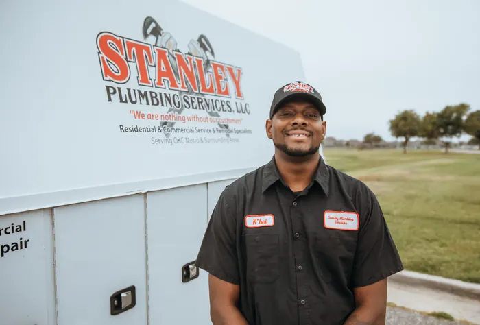 Portrait of a Stanley Plumbing Services team member (10 of 18) in uniform