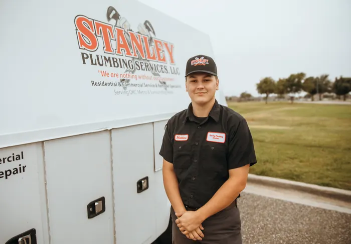 Portrait of a Stanley Plumbing Services team member (13 of 18) in uniform