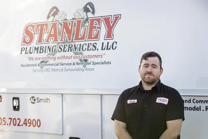 Portrait of a Stanley Plumbing Services team member (6 of 18) in uniform