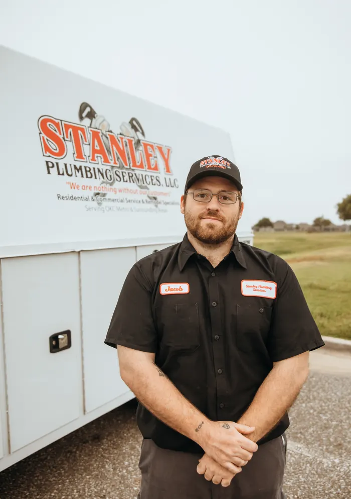 Portrait of a Stanley Plumbing Services team member (15 of 18) in uniform