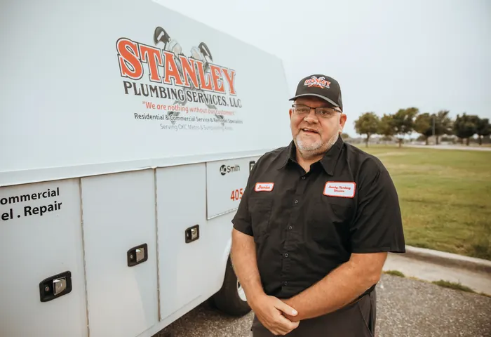 Portrait of a Stanley Plumbing Services team member (12 of 18) in uniform